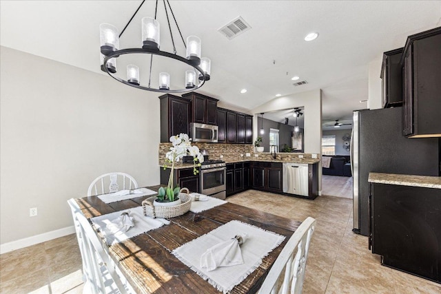dining space featuring recessed lighting, vaulted ceiling, visible vents, and ceiling fan with notable chandelier