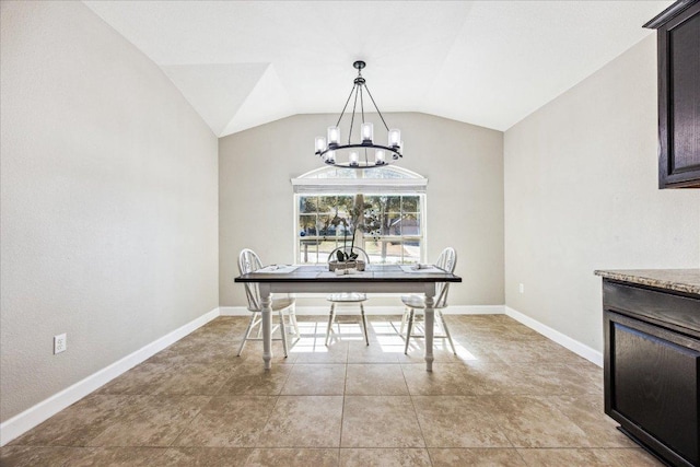 dining space featuring vaulted ceiling, light tile patterned floors, a chandelier, and baseboards