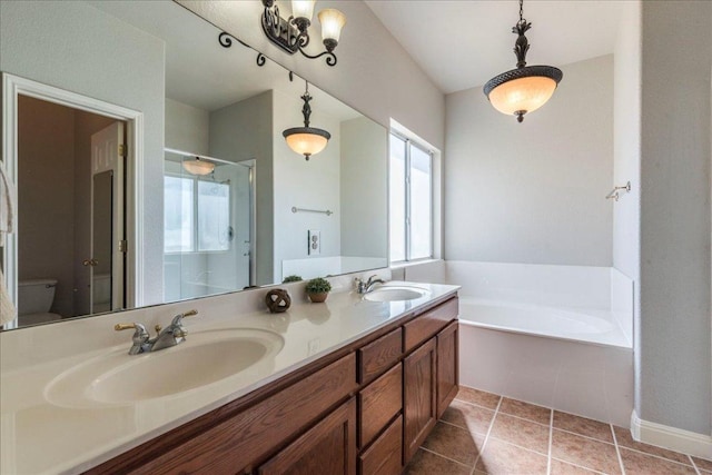 full bath with a shower stall, a sink, a bath, and tile patterned floors