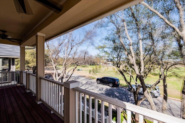 deck with a porch and a ceiling fan