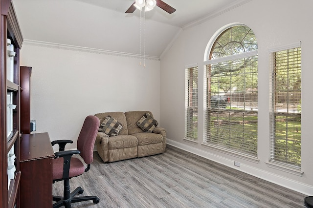 office with baseboards, ornamental molding, vaulted ceiling, and wood finished floors