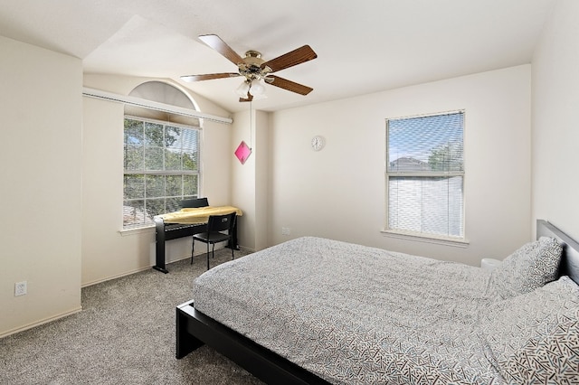 bedroom featuring lofted ceiling, carpet, a ceiling fan, and baseboards