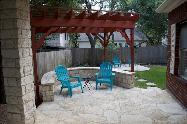 view of patio / terrace featuring fence and a pergola