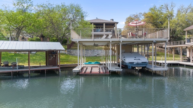 dock area featuring a water view and boat lift