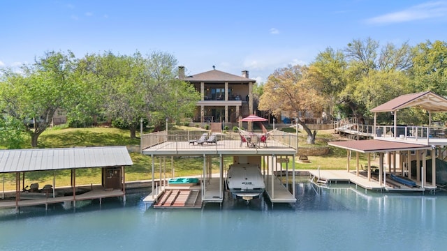 dock area with a water view and boat lift