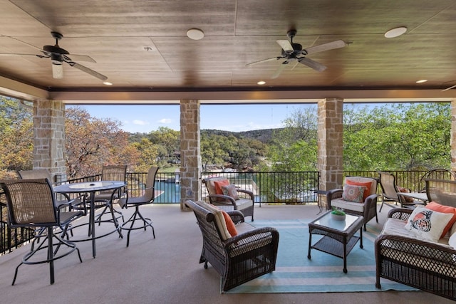 sunroom / solarium with ceiling fan