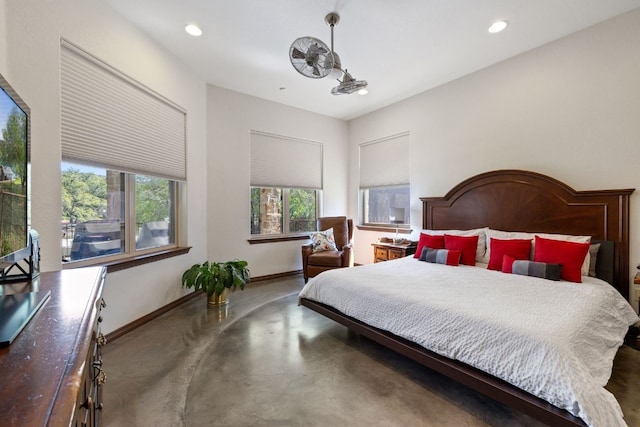 bedroom featuring recessed lighting, concrete floors, and baseboards