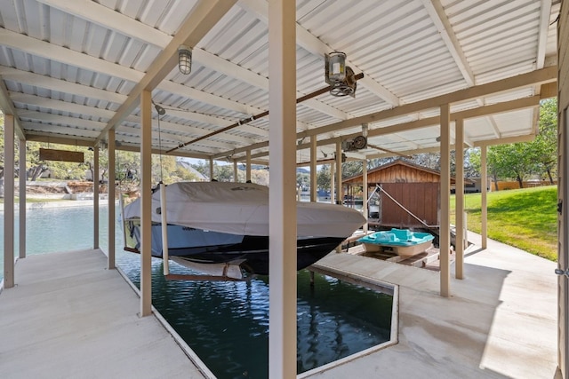 view of dock featuring a water view and boat lift