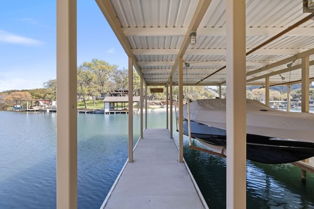 dock area featuring a water view and boat lift