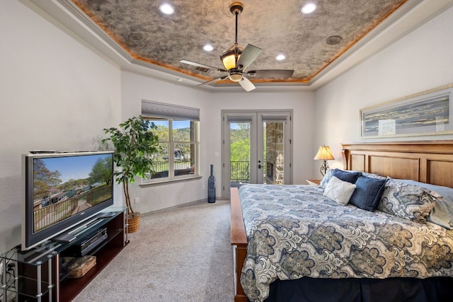 carpeted bedroom featuring visible vents, a raised ceiling, access to exterior, french doors, and recessed lighting