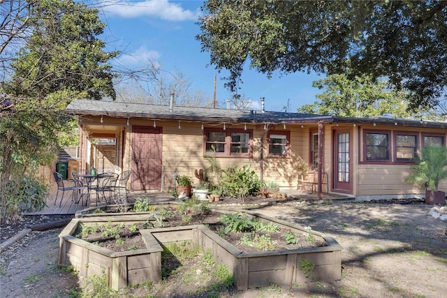 ranch-style home with a garden