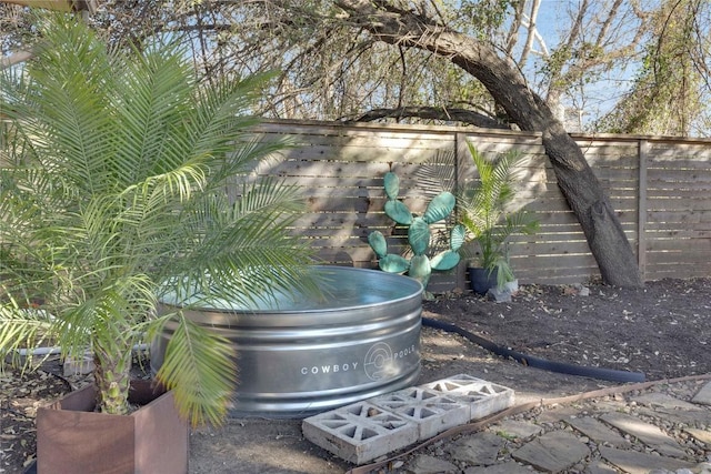 exterior details with a fenced backyard