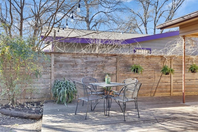 view of patio / terrace with outdoor dining space and a wooden deck