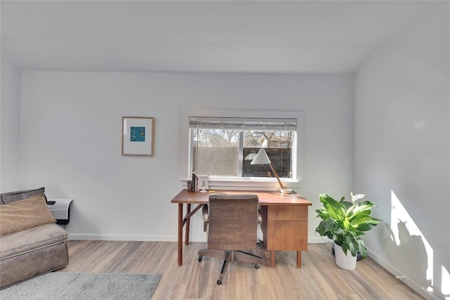 home office with wood finished floors and baseboards