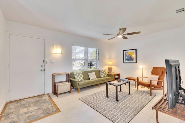 living area with visible vents and a ceiling fan