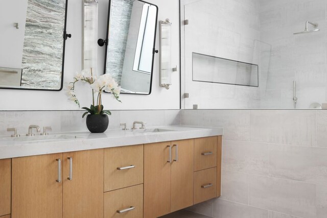 1704 Newton St, Austin, TX 78704 - bathroom featuring double vanity and a tile shower