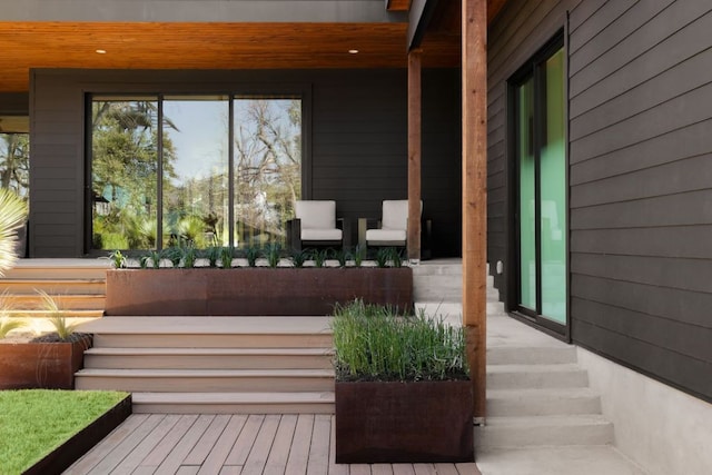 wooden terrace with a porch