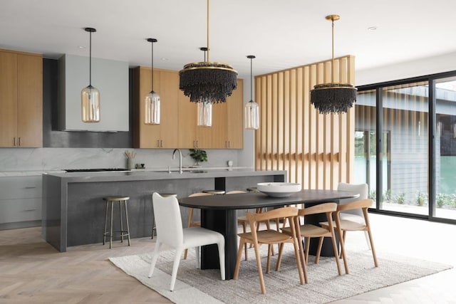 kitchen featuring a healthy amount of sunlight, a sink, and decorative backsplash