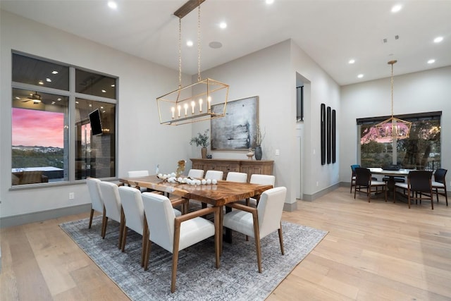 dining area featuring recessed lighting, baseboards, and light wood finished floors