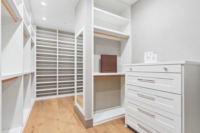 walk in closet featuring light wood finished floors