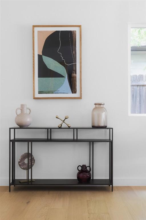 interior details featuring wood finished floors and baseboards