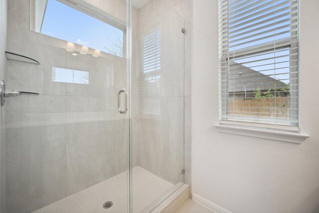 13224 Ditka Dr, Austin, TX 78652 - full bathroom with a shower stall and baseboards