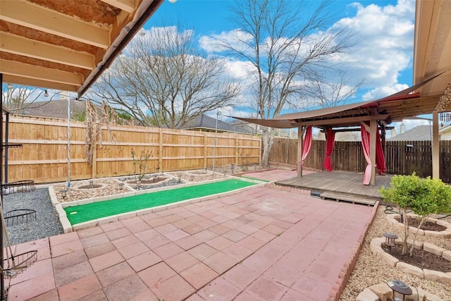 9316 Brents Elm Dr, Austin, TX 78744 - fenced backyard with a patio area and a deck