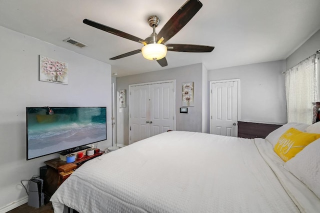 bedroom with visible vents, ceiling fan, and baseboards