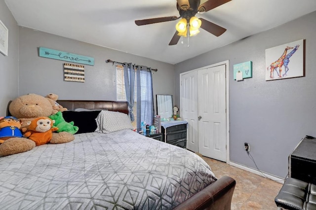 bedroom featuring a closet, ceiling fan, and baseboards