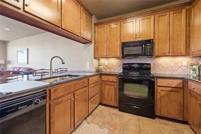 130 Sobrante Rd Unit 309, Belton, TX 76513 - kitchen with black appliances, a sink, brown cabinets, and decorative backsplash