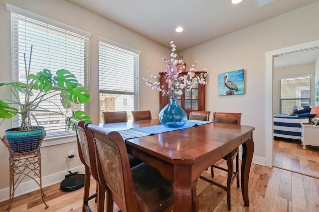 dining space featuring light wood-type flooring, baseboards, and recessed lighting