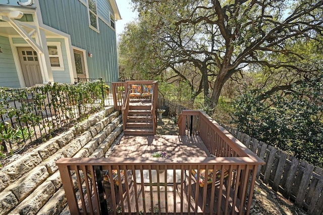 wooden deck featuring fence