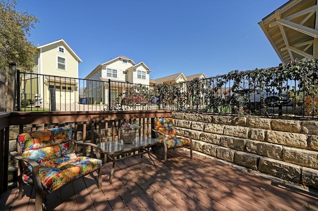 wooden terrace featuring fence