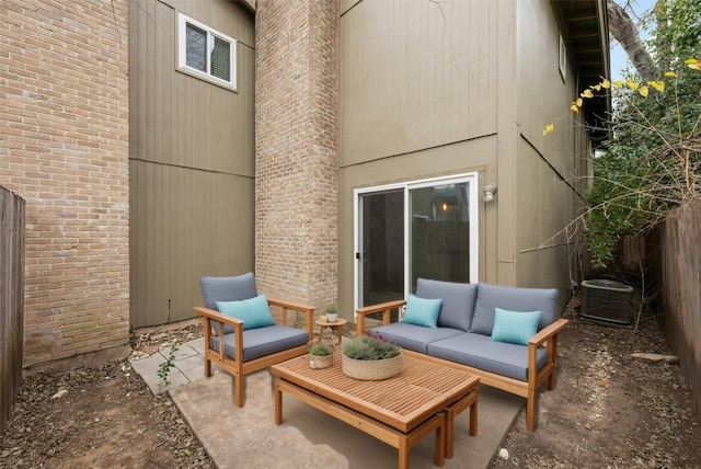 view of patio / terrace featuring central air condition unit, fence, and an outdoor hangout area