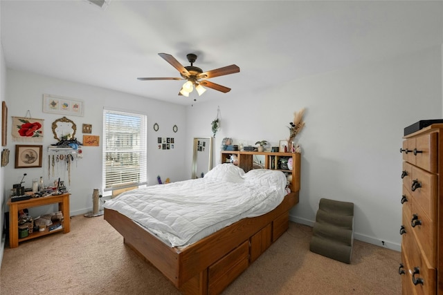 bedroom featuring light carpet, ceiling fan, and baseboards