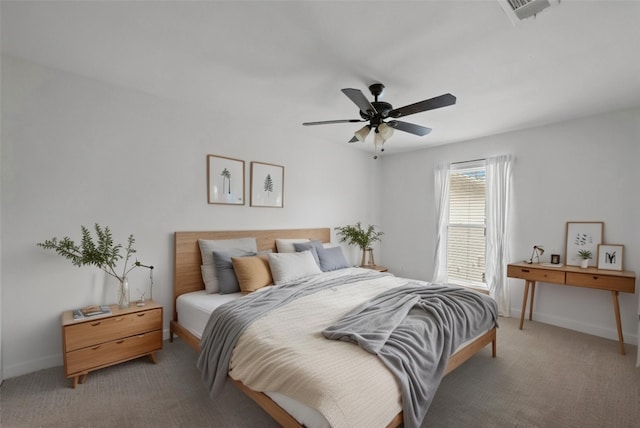 bedroom with light carpet, baseboards, visible vents, and ceiling fan