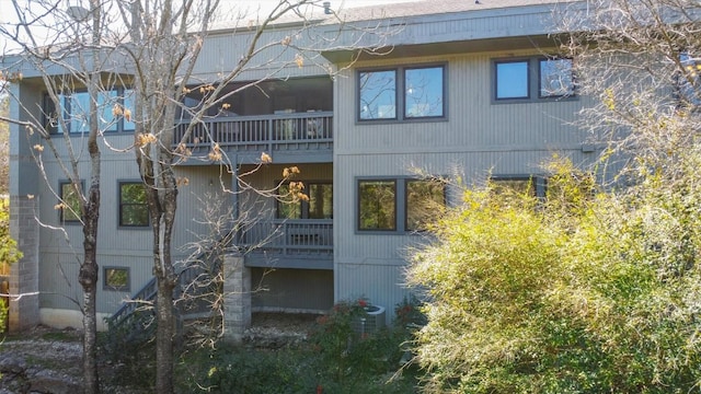 back of property with a balcony