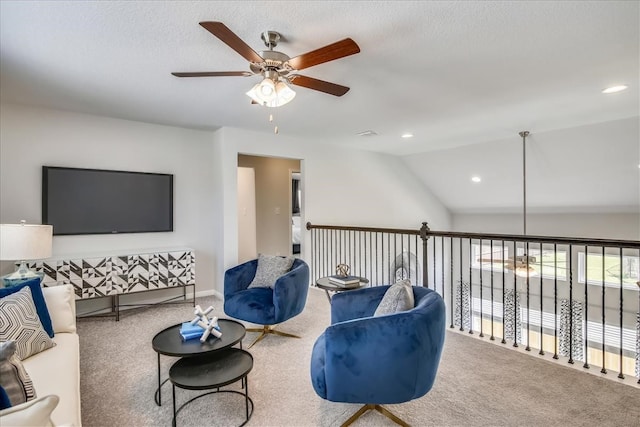 carpeted living room with lofted ceiling, ceiling fan, a textured ceiling, and recessed lighting