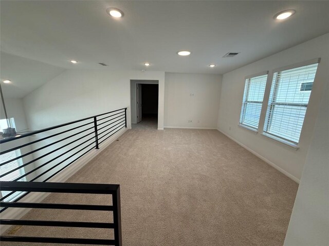 142 White Horses Dr, Kyle, TX 78640 - empty room featuring recessed lighting, light carpet, and lofted ceiling