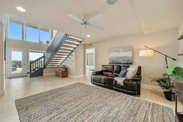 living room featuring stairway, recessed lighting, visible vents, and baseboards