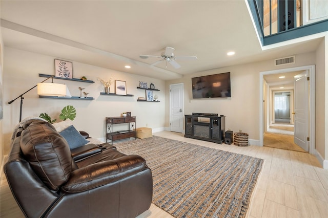 living area with baseboards, a ceiling fan, visible vents, and recessed lighting