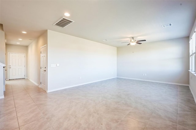 spare room with ceiling fan, recessed lighting, visible vents, and baseboards