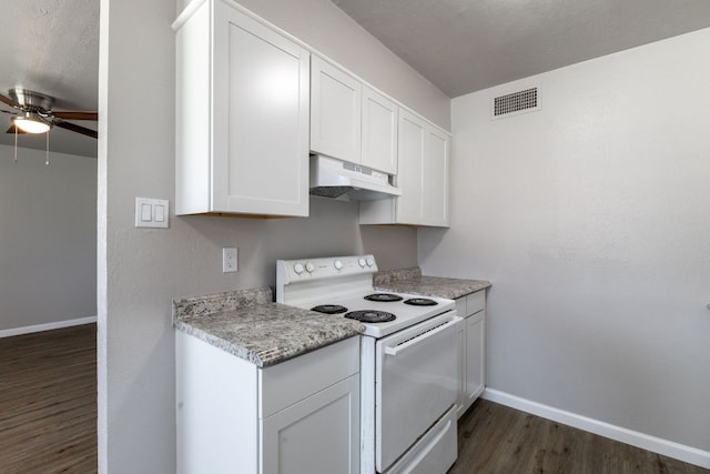 kitchen with visible vents, electric stove, light countertops, under cabinet range hood, and white cabinetry