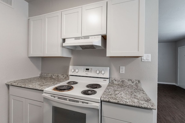 kitchen featuring under cabinet range hood, white cabinetry, white electric stove, and visible vents