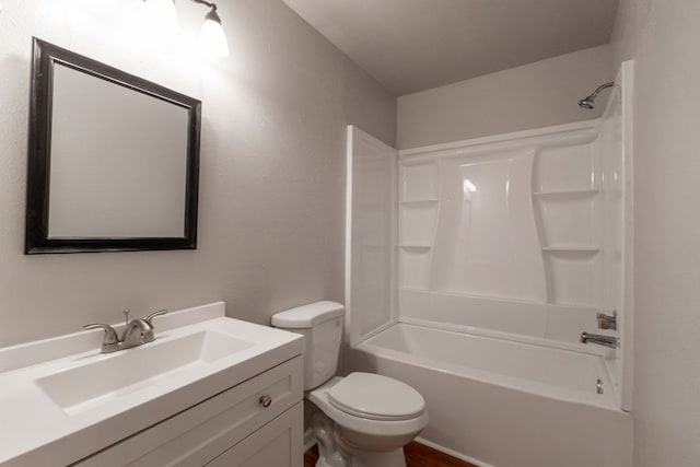 full bathroom featuring shower / washtub combination, vanity, and toilet