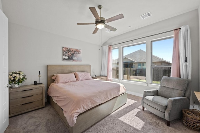 bedroom featuring carpet floors, visible vents, a ceiling fan, and lofted ceiling