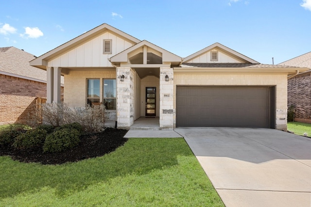 view of front facade with a garage, concrete driveway, a front lawn, board and batten siding, and brick siding