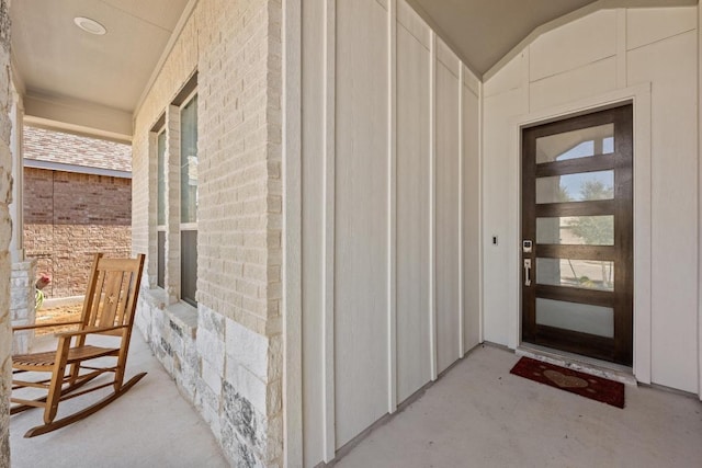 property entrance with brick siding