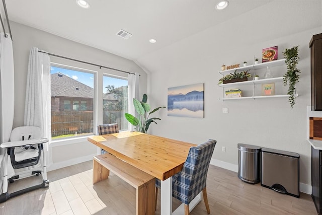 dining room featuring baseboards, light wood-style floors, visible vents, and recessed lighting