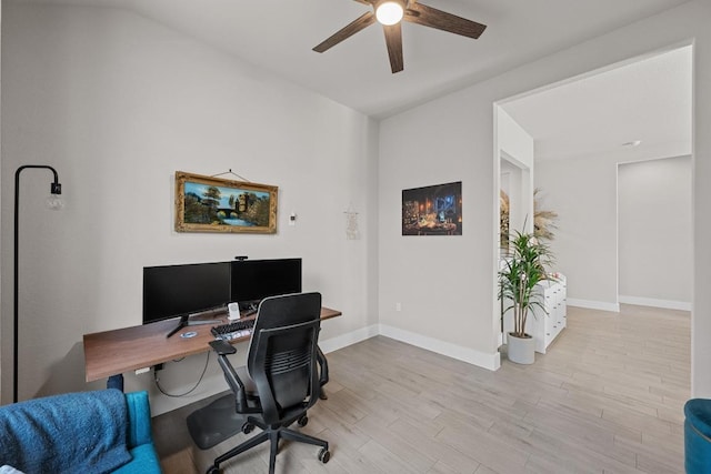 office area featuring wood finished floors, a ceiling fan, and baseboards